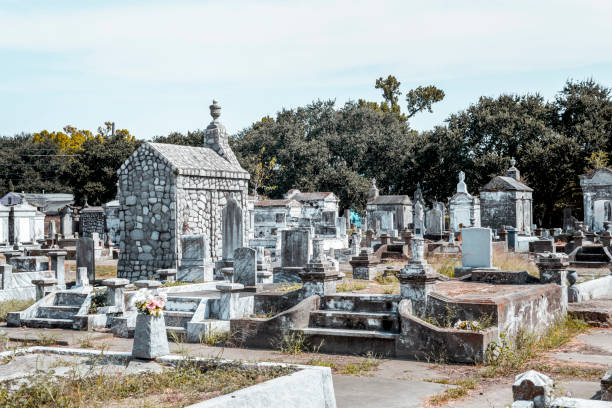 A sunny day in an old cemetery with ruined ornamental tombs - Lafayette Cemetery No. 2 in New Orleans.